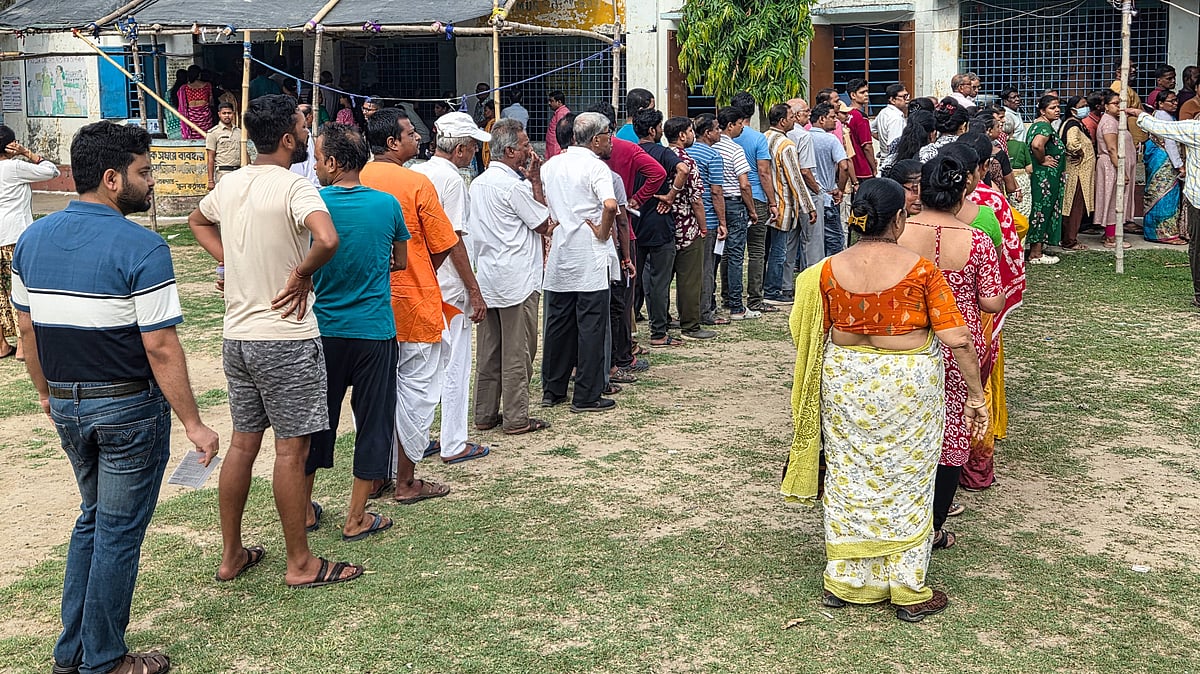 Voters queue outside a polling station in Berhampore during Phase 1 of Bengal polls.