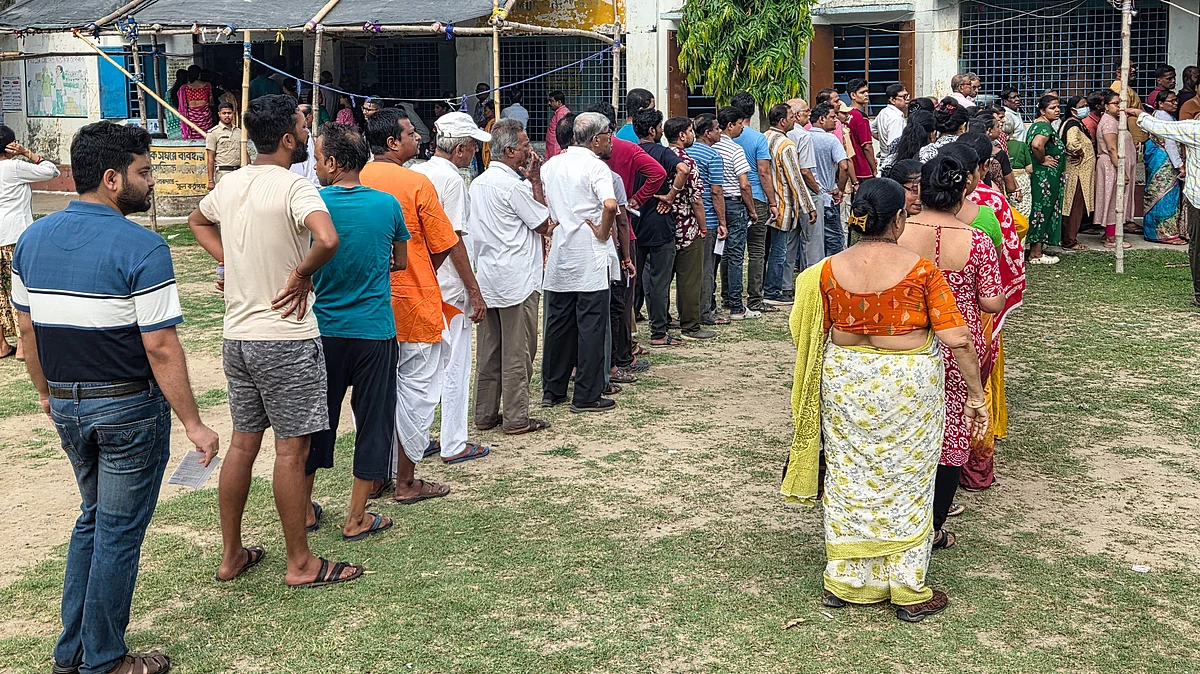 Voters queue outside a polling station in Berhampore during Phase 1 of Bengal polls.