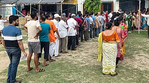 Voters queue outside a polling station in Berhampore during Phase 1 of Bengal polls.
