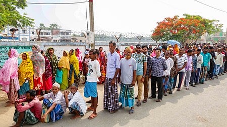 Voters line up at a polling booth