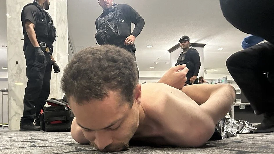 Gunman in police custody.