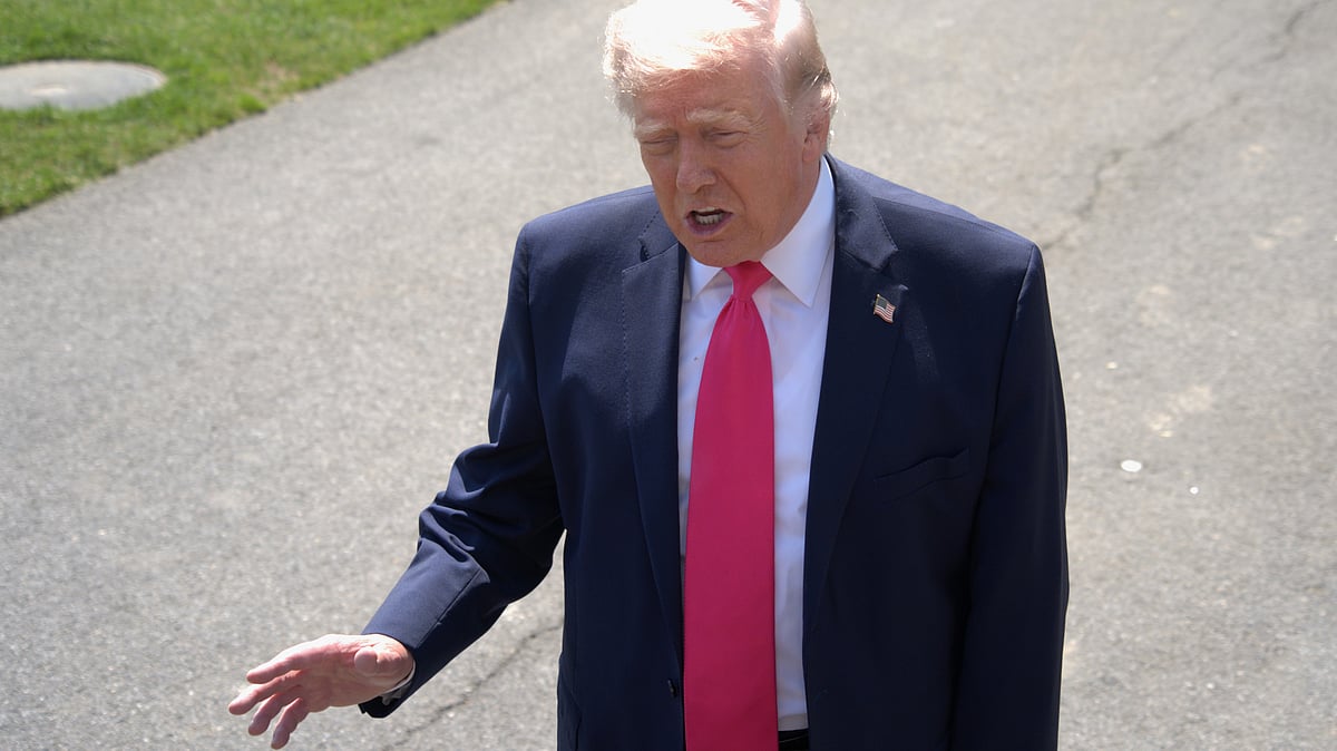 Donald Trump speaks to reporters on South Lawn of White House in Washington.