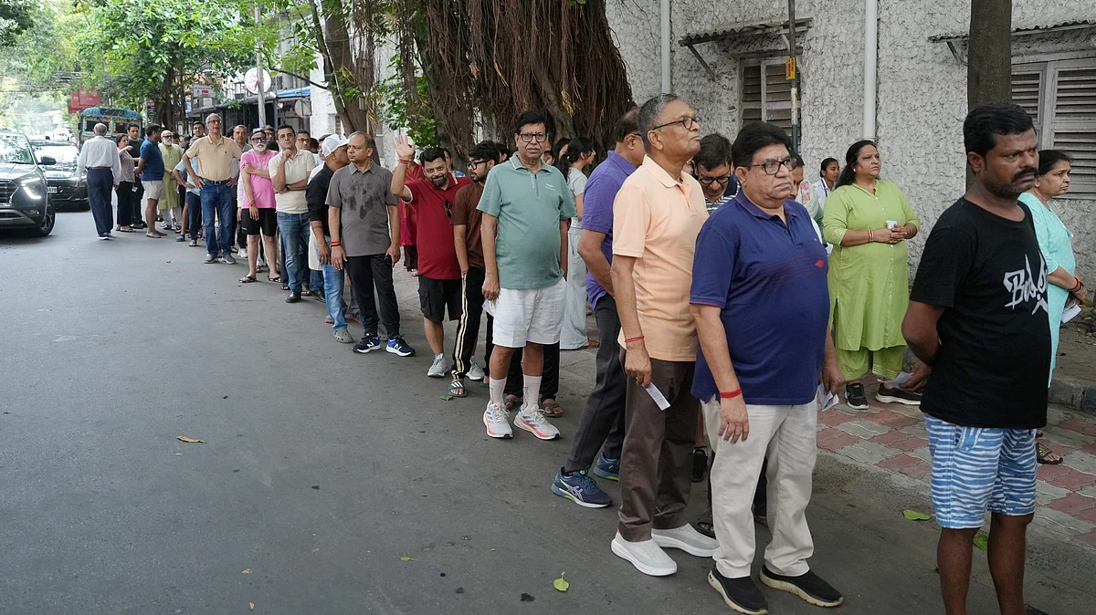 Voters queue up to cast their ballots during phase II of the West Bengal assembly elections in Kolkata.