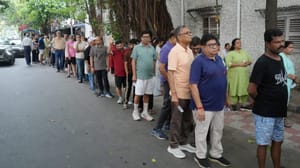 Voters queue up to cast their ballots during phase II of the West Bengal assembly elections in Kolkata.