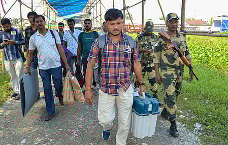 Polling personnel arrive at a voting station in West Bengal