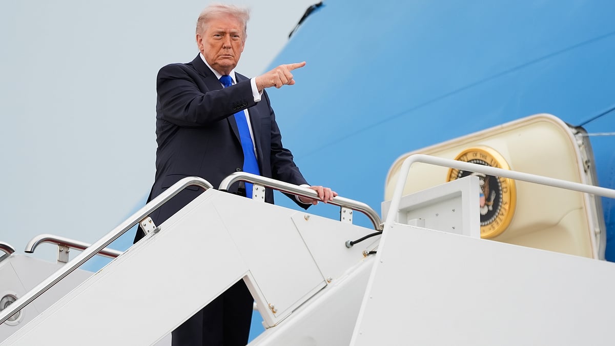 Donald Trump gestures while boarding Air Force One at Joint Base Andrews, Maryland.
