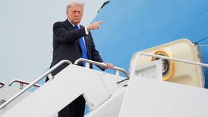 Donald Trump gestures while boarding Air Force One at Joint Base Andrews, Maryland.
