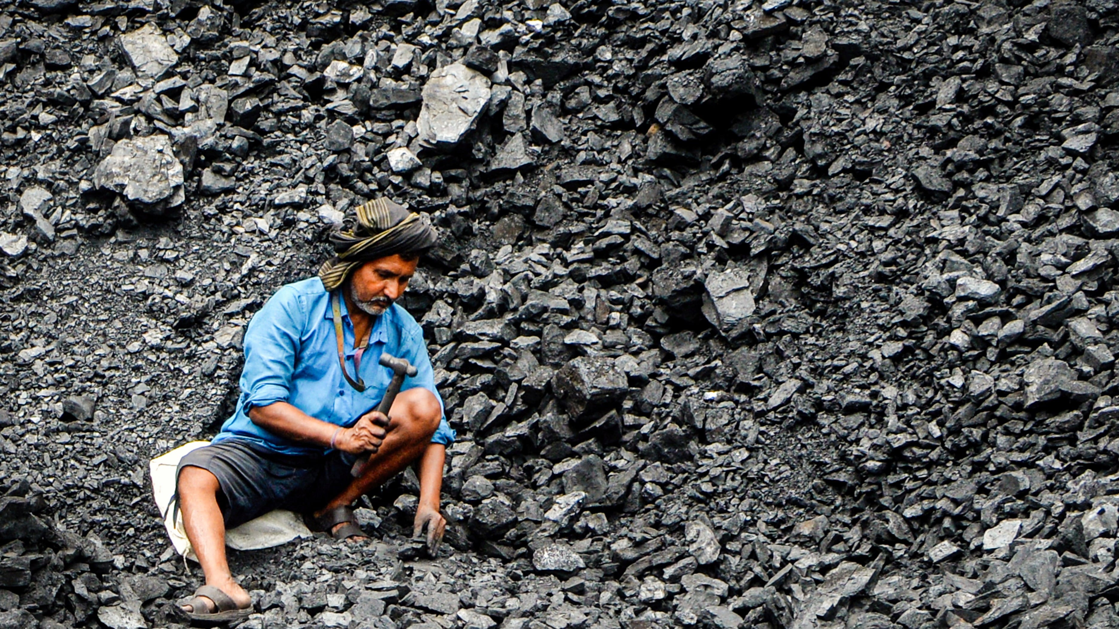 A coal depot worker in West Bengal. Echoes of Chicago 1886?