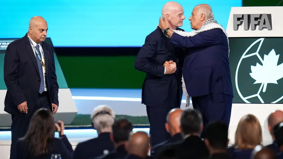 Gianni Infantino with the Palestine (right) and Israel official on stage at FIFA Congress