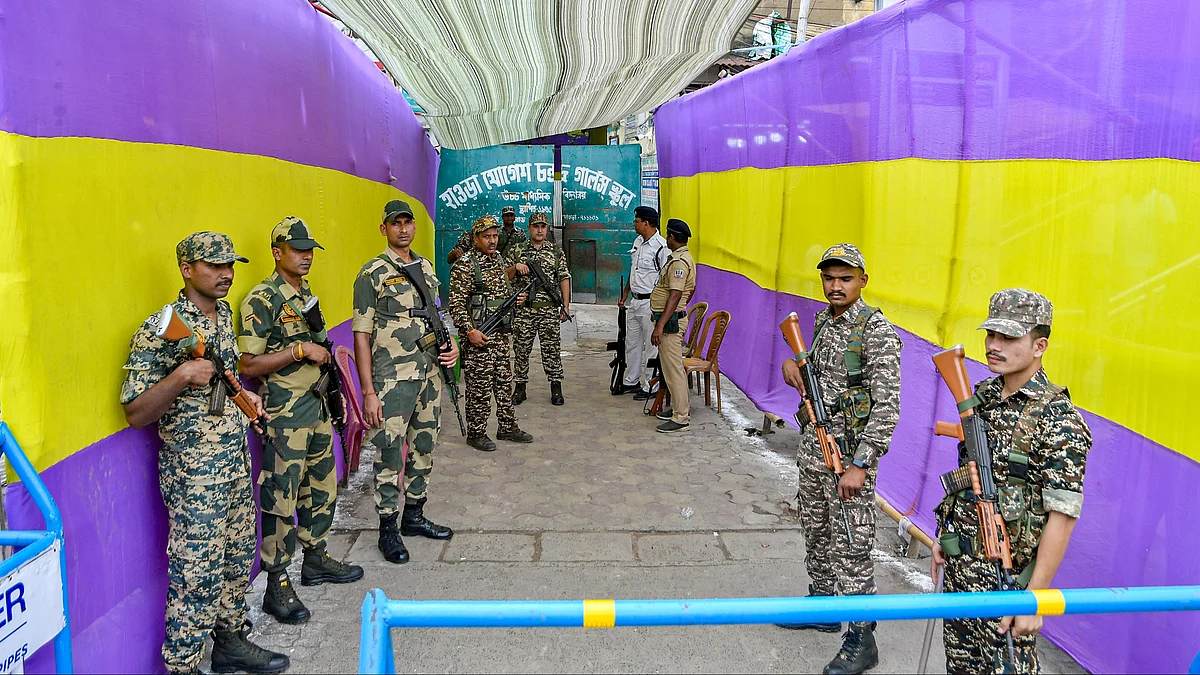 Security personnel stand guard outside a strong room in Howrah.