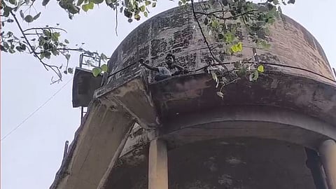 Aligarh Harassment Case Youth Climb Water Tank Demanding Strict Police Action
