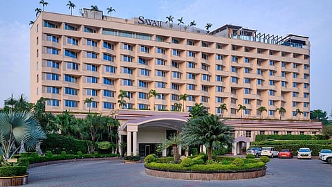 Food safety officials inspect samples collected from Sayaji Hotel.