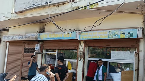 Thief fleeing with a cash-filled bag from a medical store