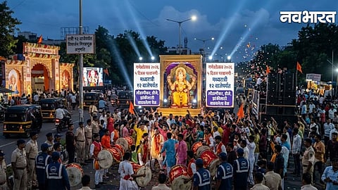Grand tableaux of Ganeshotsav and crowds of devotees at night in Pune