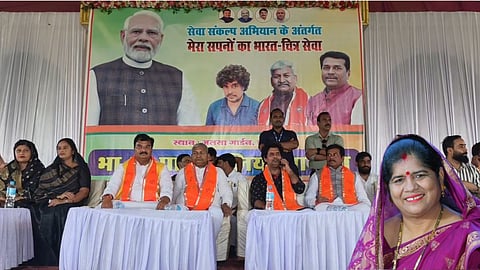 Imarti Devi sitting among workers instead of joining the stage