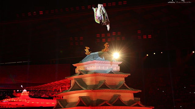 suspended high in the air illuminated replica of a historic Japanese castle