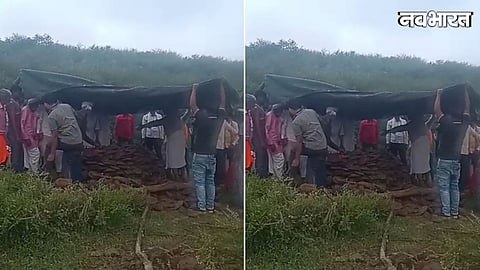 funeral performed under tarpaulin during rain in Panchampura