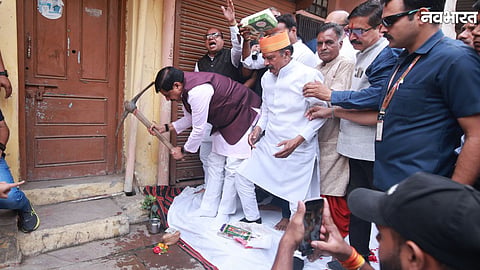 CM Mohan Yadav using a pickaxe at his ancestral house