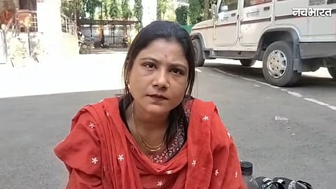 Woman sitting in protest outside Kotwali police station in Chhindwara
