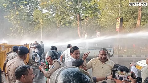 Police use water cannons to disperse BJP and Congress workers during a protest