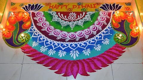 Diwali rangoli significance main entrance.