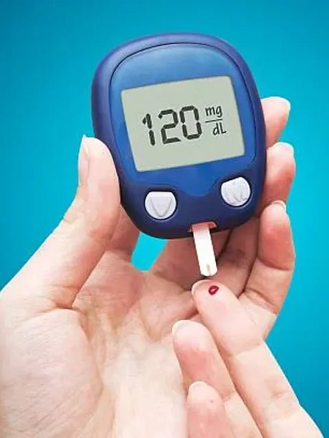 Woman doing blood sugar test