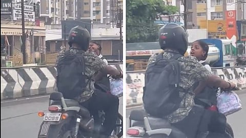 A viral video of a man riding a bike with his young daughter facing him has sparked outrage online, with users calling it a dangerous and irresponsible act.