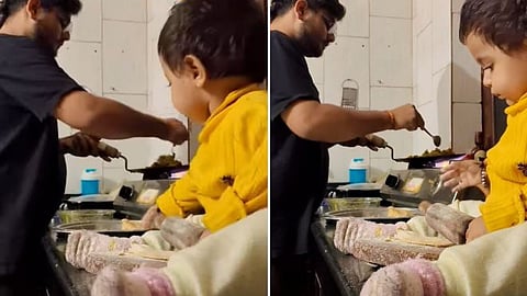 A heartwarming video of a father cooking to pacify his upset wife while his little daughter adorably helps by making rotis is winning hearts on social media.