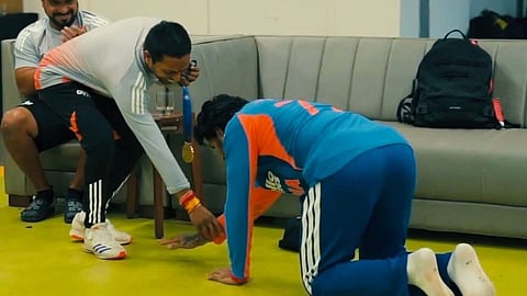 Tilak Varma touches Raghu's feet in dressing room