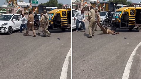 A middle-aged man’s clash with police on a busy road shocks viewers online.