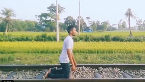 A man risked his life by lying under a moving train for a reel, sparking outrage after the video went viral.