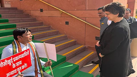 Suspended MP Dr. Prashant Padole protests at Parliament stairs for Gosikhurd dam victims. Priyanka Gandhi meets him to discuss rehabilitation & compensation.