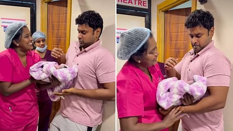 A father trembled with emotion while holding his newborn for the first time.