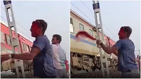 A viral video showing men throwing coloured water and mud at a moving train has sparked outrage online, with many demanding strict action.
