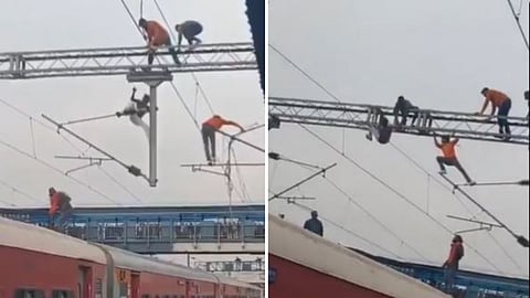 A viral video shows youths fighting atop high-voltage railway gantries at Manmad station, raising safety concerns.