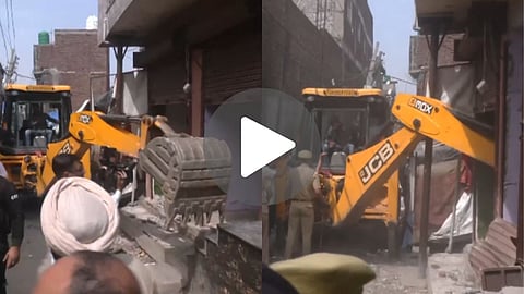 Jammu administration demolishes three illegal structures of absconding drug peddlers Bhalo and Monika in Rajiv Nagar under the 100-day Nasha Mukt Bharat campaign.