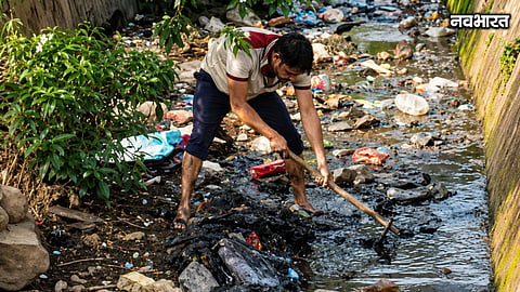 panvel sarpanch sitaram choudhary cleans sewage drain himself dhodani village