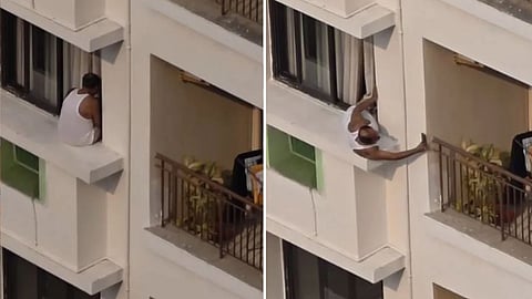 A viral video showing a man dangerously leaning out of a window toward a neighbour’s balcony has sparked debate online.