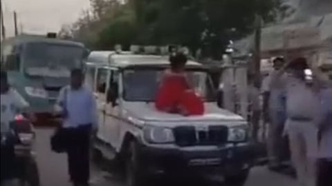 Shivpuri Woman Sitting on Police Car