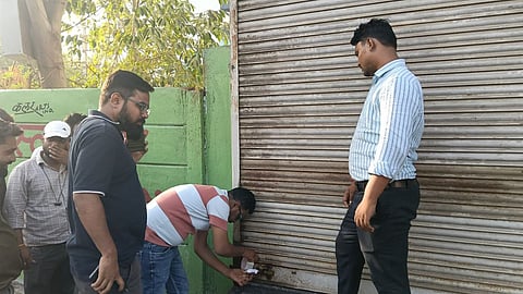 Indore Municipal Corporation officials sealing commercial establishments, including hotels and a mall, during a fire safety enforcement drive against buildings lacking proper fire protection systems in Indore.