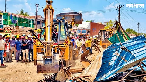 Encroachments on Pune-Indore highway in Manmad were demolished using JCBs amid police tight security. Local traders protested, questioning the entry ban on heavy vehicles.
