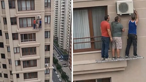 A video showing three men repairing an AC unit on a high-rise building without safety gear has gone viral.