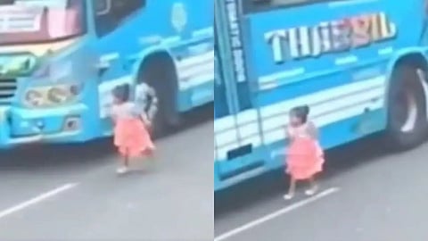 A little girl narrowly escaped being hit by a bus while crossing the road, and the shocking incident has gone viral on social media.
