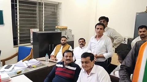 Indore Congress city president Chintu Chouksey speaks to the media after nearly five hours of police questioning at Pandhrinath Police Station, as Congress leaders and supporters gather outside.