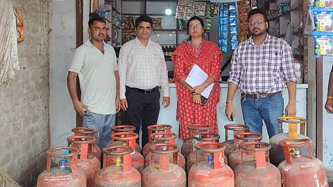 Food Department officials seize 17 illegally stored domestic LPG cylinders during a raid at Sagore Kuti area in Indore.