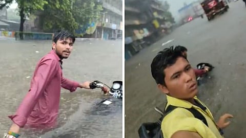 A viral video of two employees pushing their bike through heavy rain while joking about reaching the office has sparked discussions on corporate work culture.
