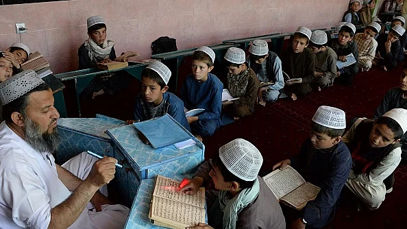 उत्तर प्रदेश के एक मदरसे में पढ़ते बच्चे /फोटो - Getty Images