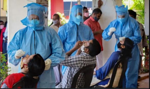 बढ़ते कोरोना मामलों के बीच नई गाइडलाइंस पर घिरी केरल सरकार, विपक्ष के विरोध के बावजूद वापस लेने से इनकार