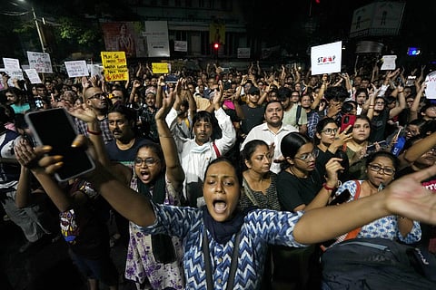 People gather at Jadavpur at mid-night on the eve of Independence Day to protest against the rape and killing of a trainee doctor at the RG Kar Medical College, in Kolkata, Wednesday, Aug. 14, 2024.