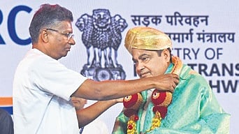 Karnataka PWD Minister Satish Jarkiholi greets Union Minister Nitin Gadkari in Bengaluru on Thursday